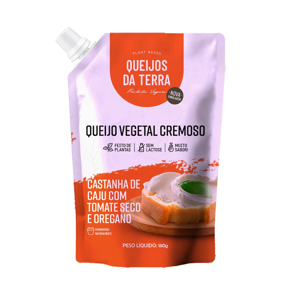 Queijo Cremoso de Castanha de Caju com Tomate Seco e Orégano. Embalagem de cor laranja vista de frente.