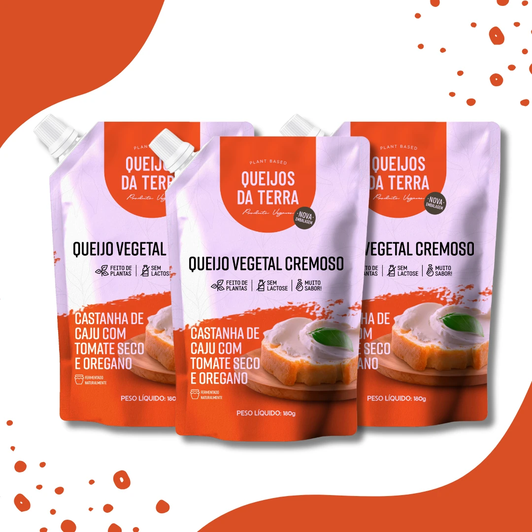 Kit de 3 Queijos Cremosos de Castanha de Caju com Tomate Seco e Orégano. Embalagem de cor laranja vista de frente.